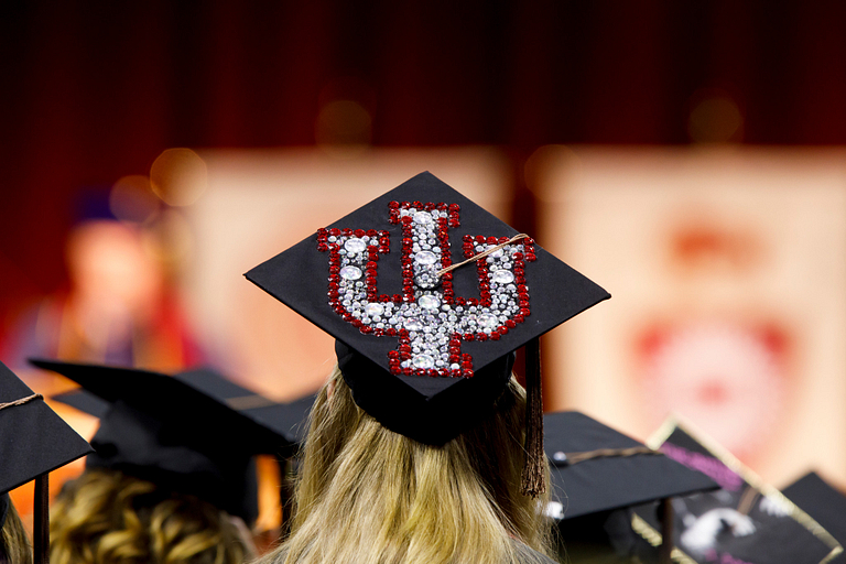 An IU trident design on a mortarboard 