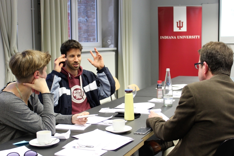 People talk around a table