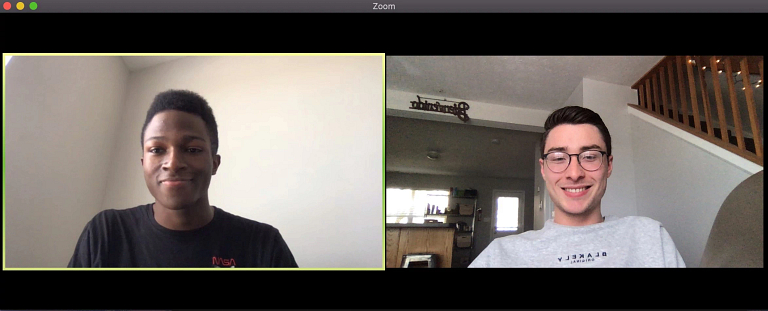 Elijah Walker and Evan Catron talk remotely through a video chat.