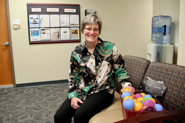 Julia Lash sits in the lobby of CAPS