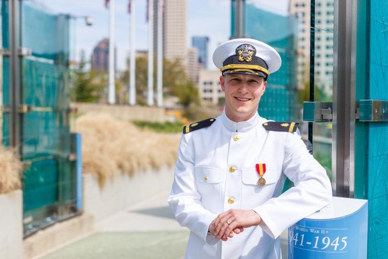 Huntington Hardisty poses next to the Congressional Medal of Honor Memorial.