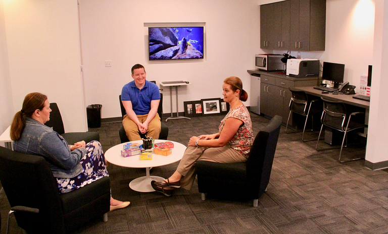 People sit in the office.