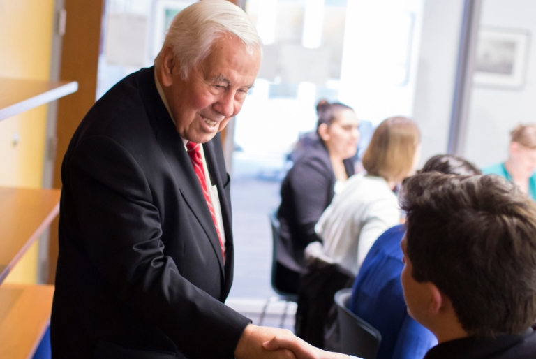 Richard Lugar shakes a student's hand