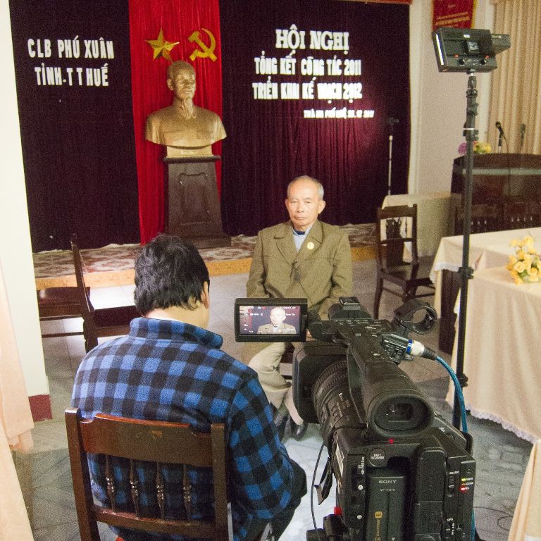 Chung Nguyen prepares to interview a North Vietnamese veteran