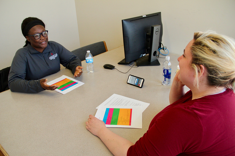 Students tape a podcast.