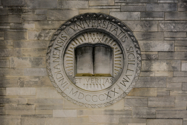 The IU seal on a limestone building 