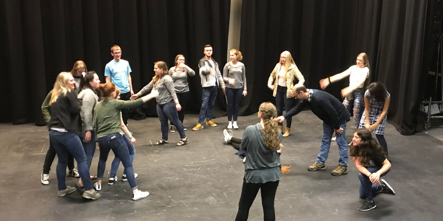 Students participate in a drama workshop