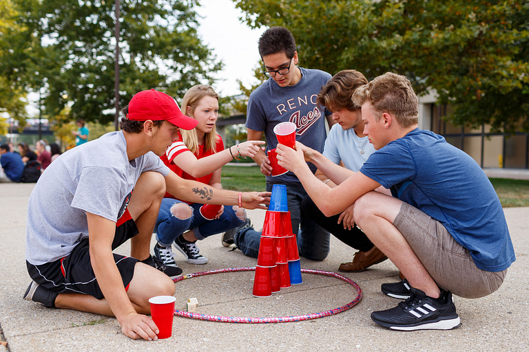 Students stack cups.