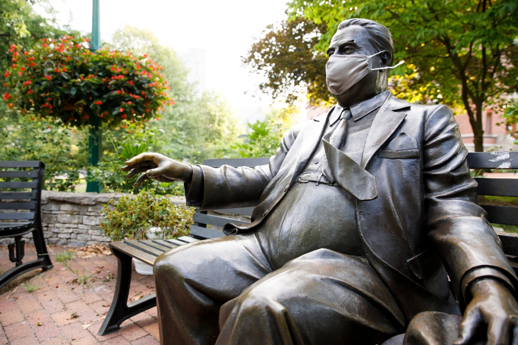 Herman B Wells statue with a mask on