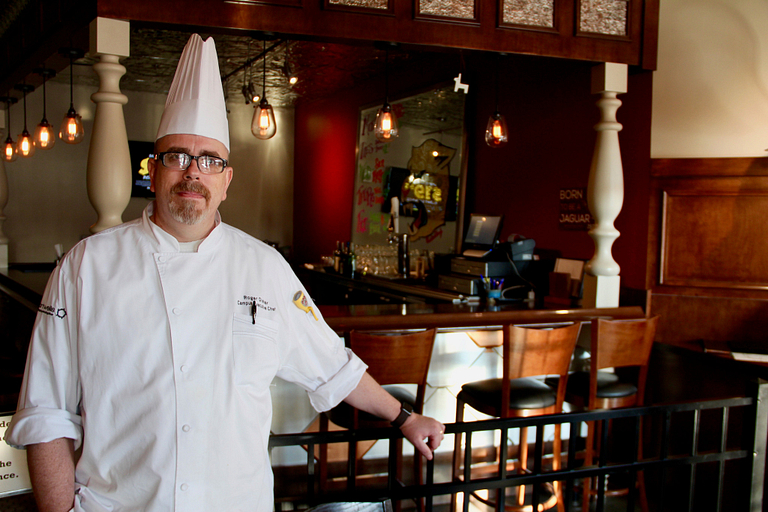 Executive Chef Roger Disher stands in the bar area in an IUPUI restaurant
