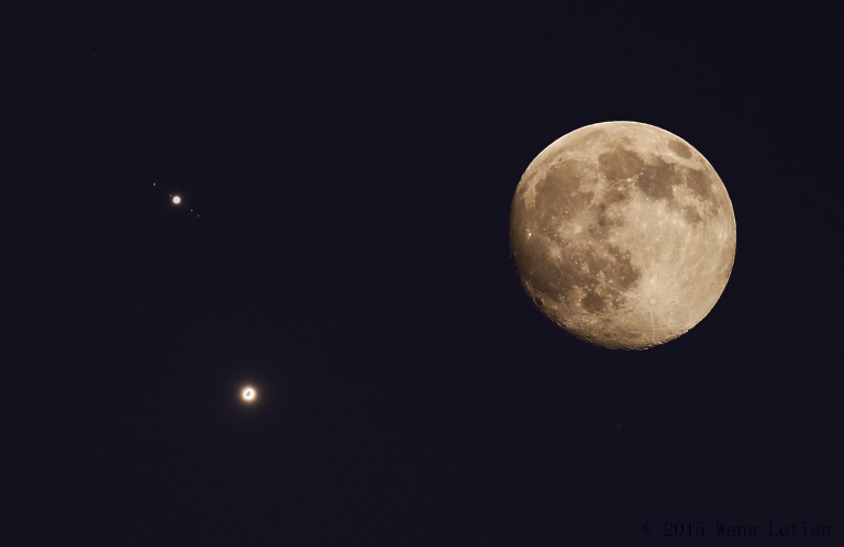 Jupiter and Venus appear close to each other near a full moon.