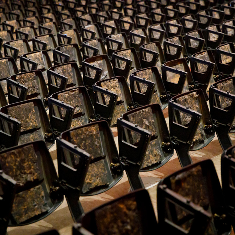 Seat bases without cushions or backs in the Musical Arts Center