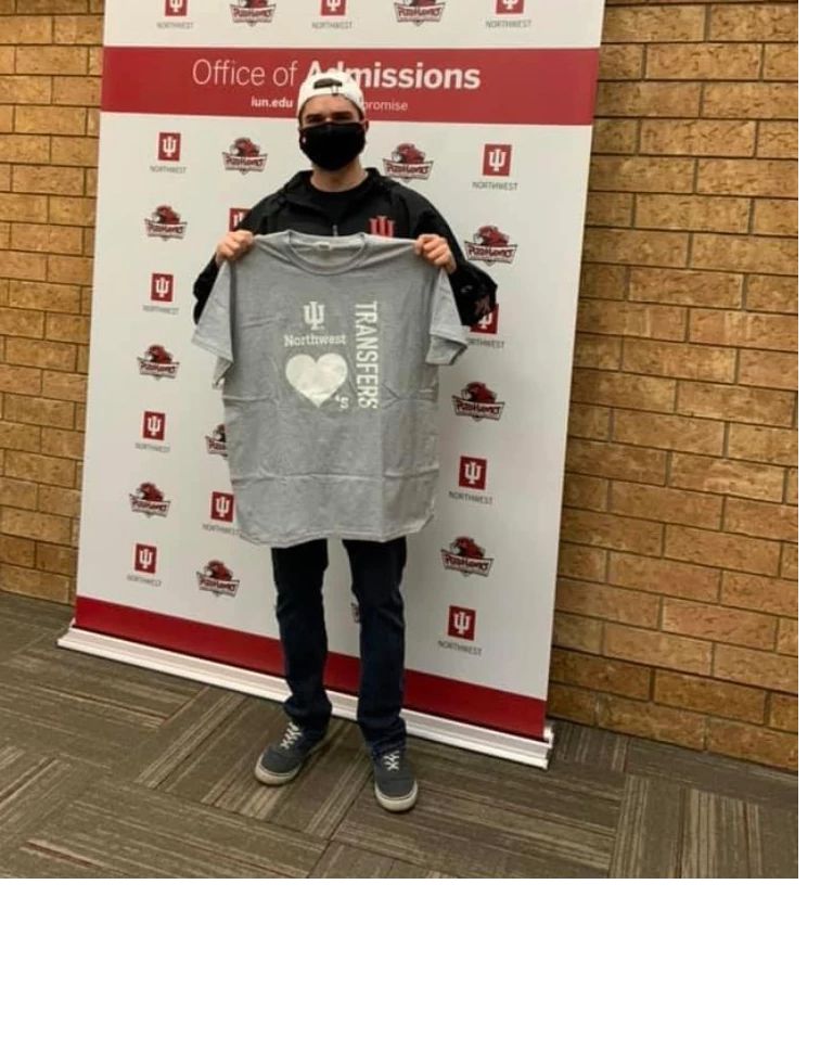 a man poses with a shirt that reads 