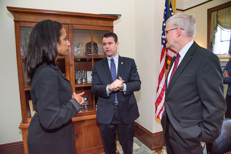 Una Osili, Sen. Todd Young and InterAction CEO Sam Worthington at a pre-hearing meeting. 