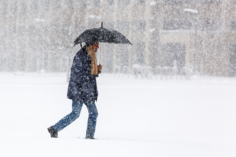 Student walks in heavy snow.