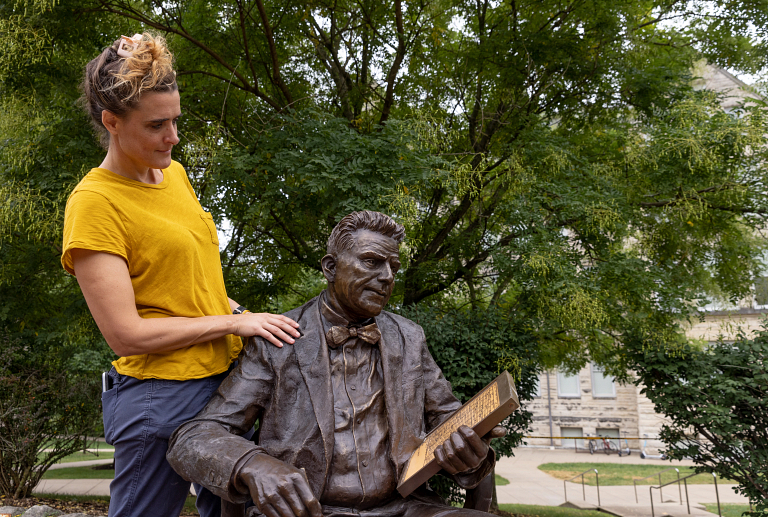 Melanie Cooper Pennington with a sculpture of Alfred Kinsey