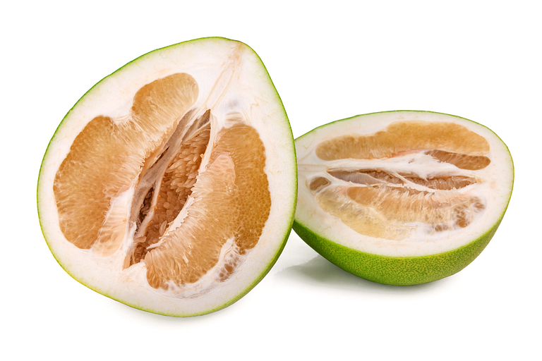 A pomelo, cut in half to show the interior