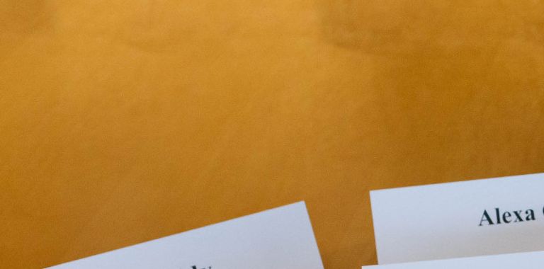 Name tags of members of the Chancellor's Student Advisory Board are organized on a table.