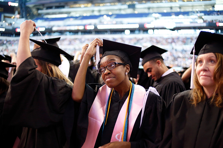 Students turn their tassels at the 2017 IUPUI commencement.