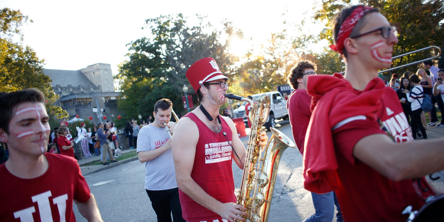 Members of the alumni band march in the homecoming parade.