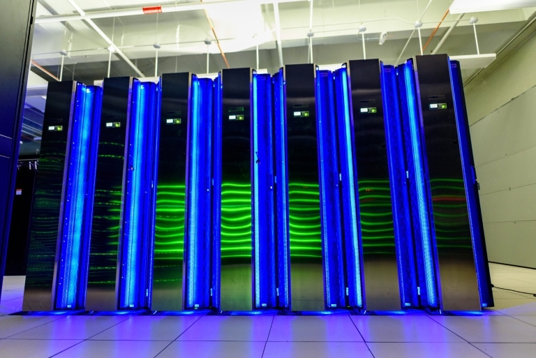 Illuminated blue CPU towers of the Jetstream cloud computing system