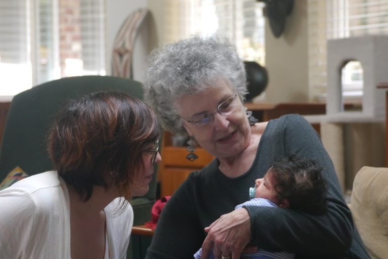 Beverly Stoeltje holds Suncem Kocer's daughter Ayla.