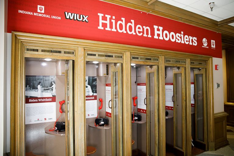 The Hidden Hoosiers phone booths line a wall at the IMU