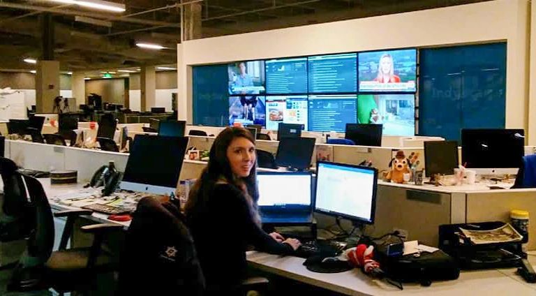 Sarah Bahr sits at her desk in the IndyStar newsroom