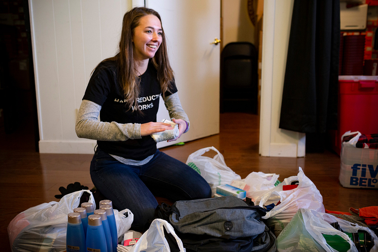 Arielle Hacker puts together supplies.