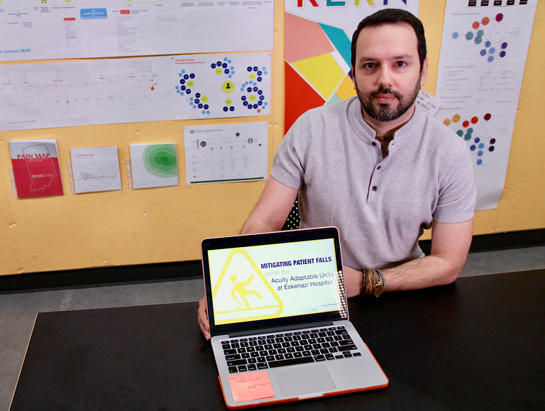 Iman Pirzadeh sits with his computer.