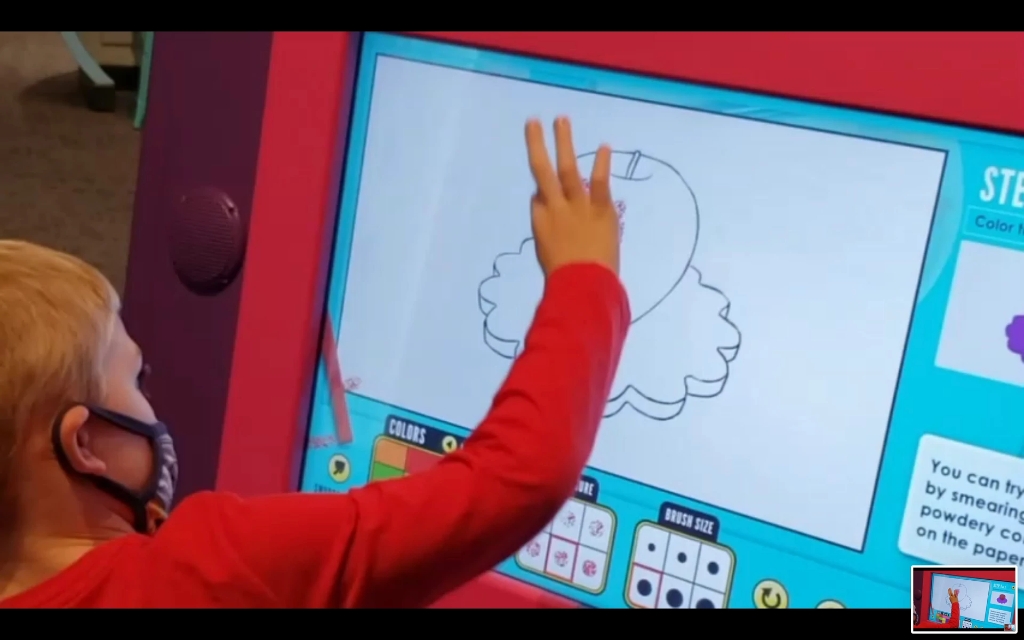 A child uses an interactive exhibit at the Indianapolis Children's Museum
