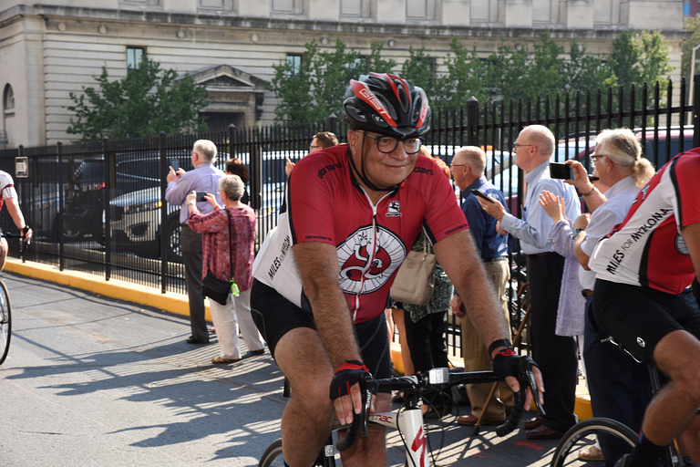 Dr. Rafat Abonour on a bicycle in the Miles for Myeloma event.