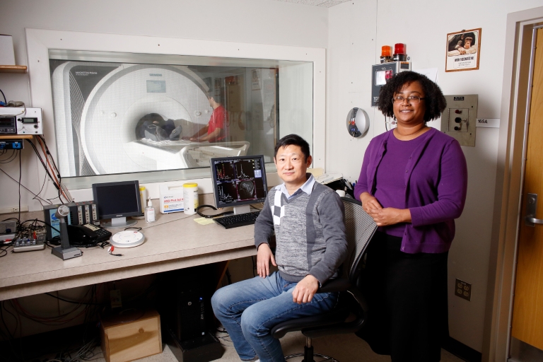 IU professor Sharlene Newman and senior scientist Hu Cheng in an imaging lab