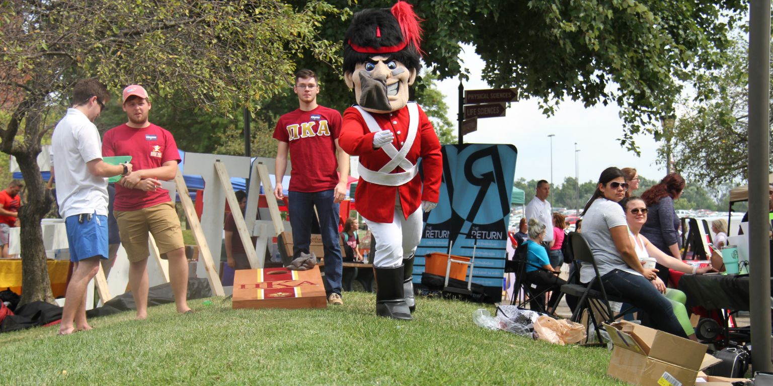 IU Souteast's Gus the Grenadier mascot plays corn hole with students