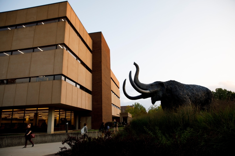 The statue of a mammoth outside of a building on the IU Fort Wayne campus