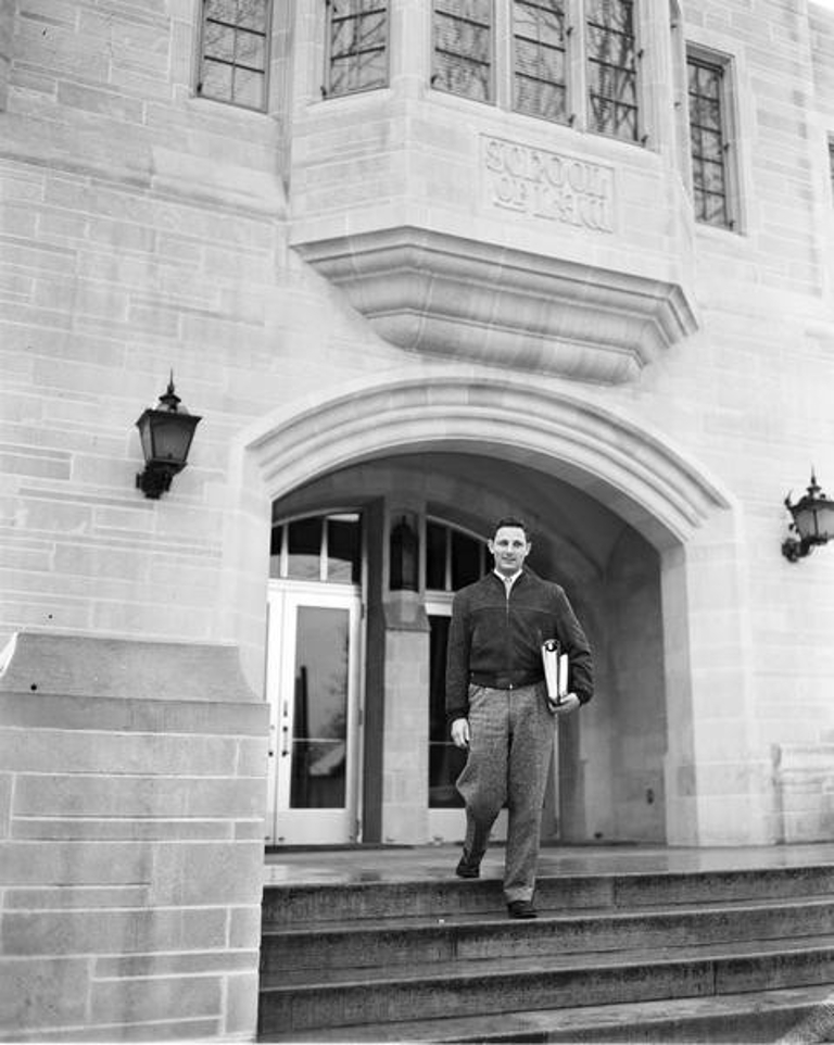 Birch Bayh standing outside the School of Law building