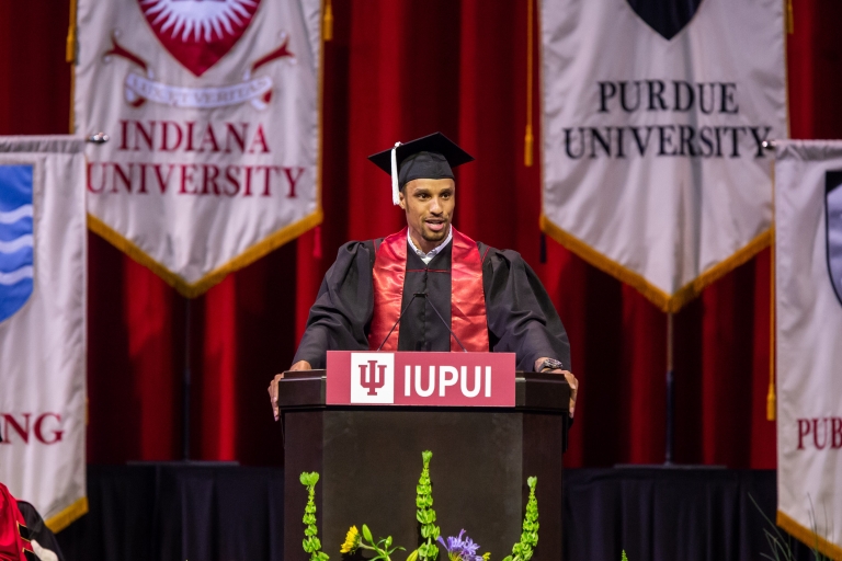 Graduate George Hill gives the student address during Commencement.