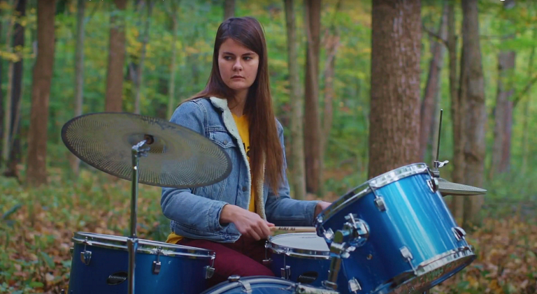 Woman plays drums