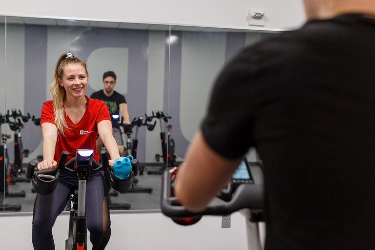 Madison Crisler on a spin bike.