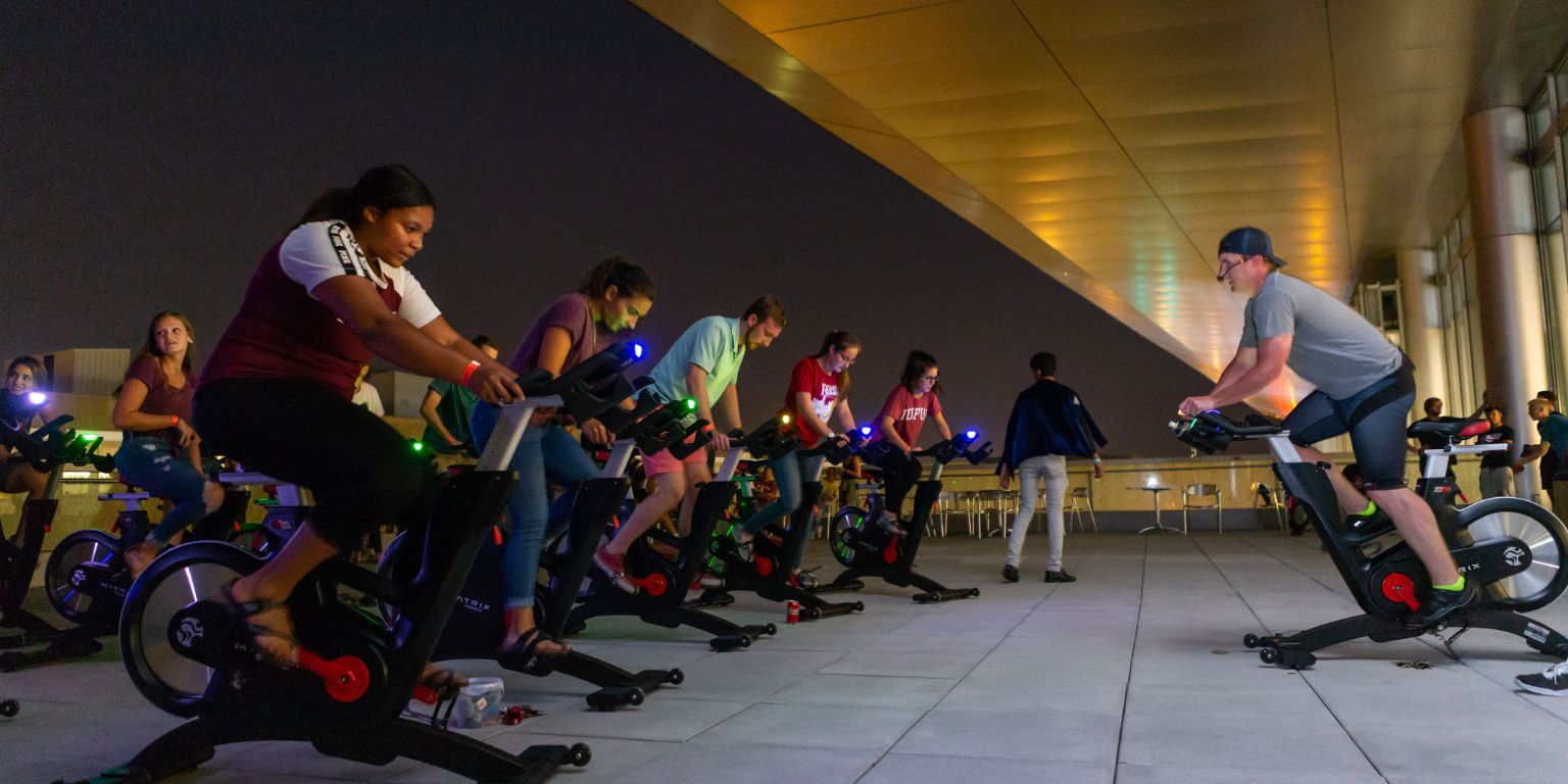 Students take a spin class on the roof of the IUPUI Campus Center