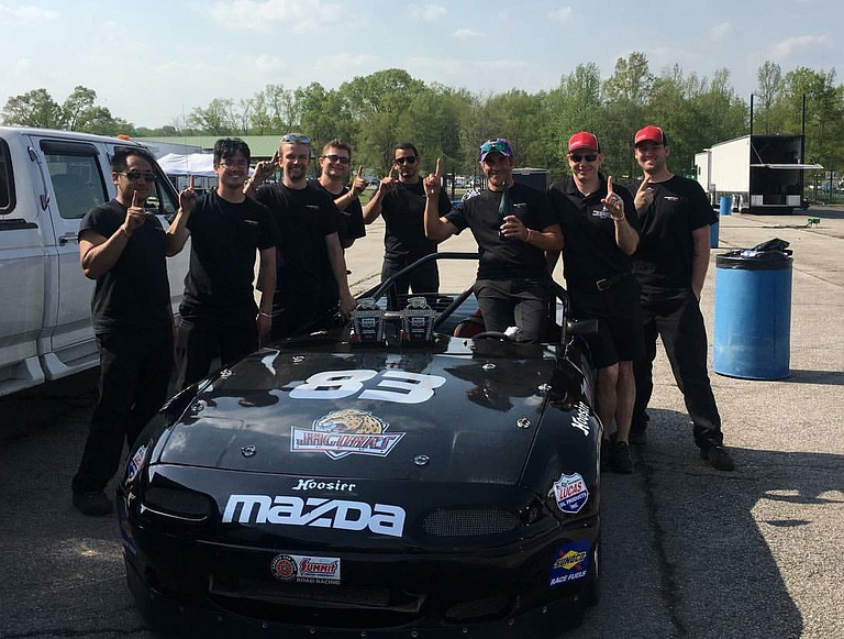 IUPUI motorsports engineering students with their car