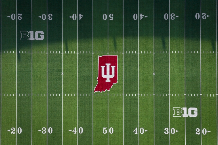 IU logo on the center of a football field seen from above