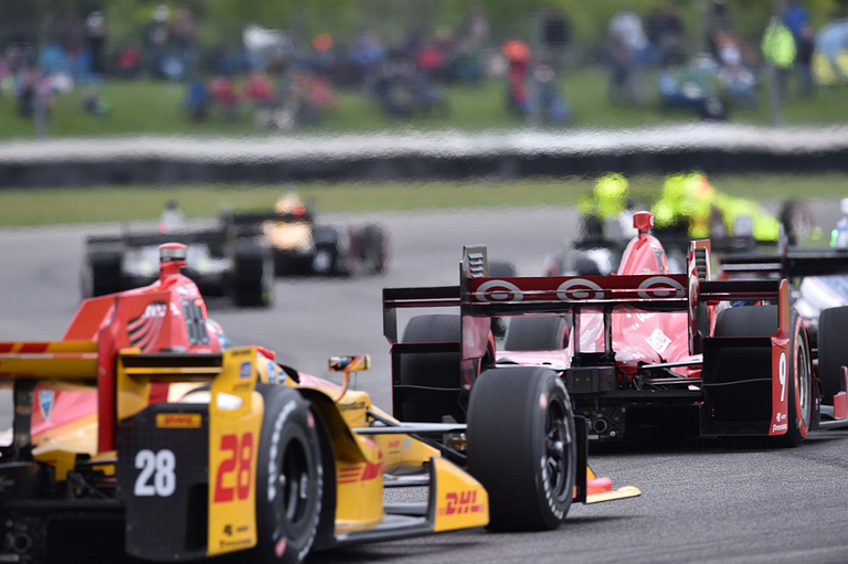 IndyCars on the track at the Indianapolis Motor Speedway