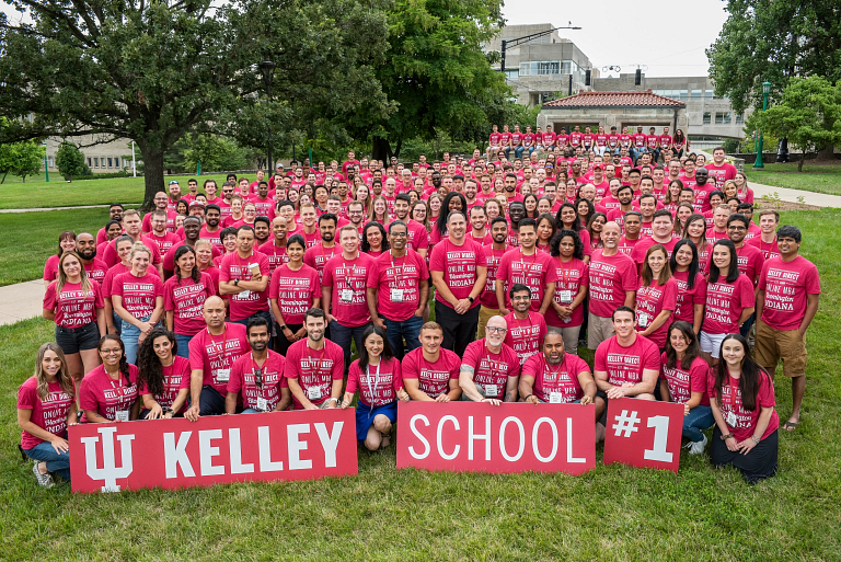 A group of 250 students gather for a group photo outdoors.