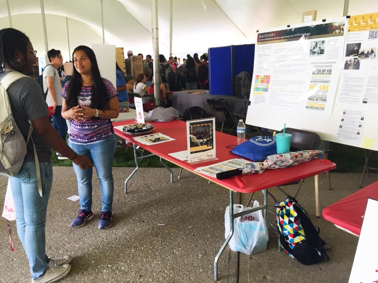 The Enactus president converses with a potential new member.