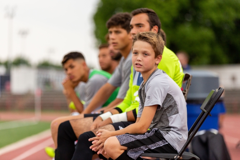 Tyler Harris watches IUPUI men's soccer from the team's bench.