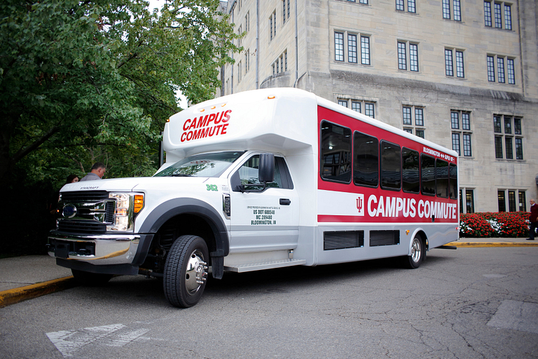 The Campus Commute shuttle parked at the IMU