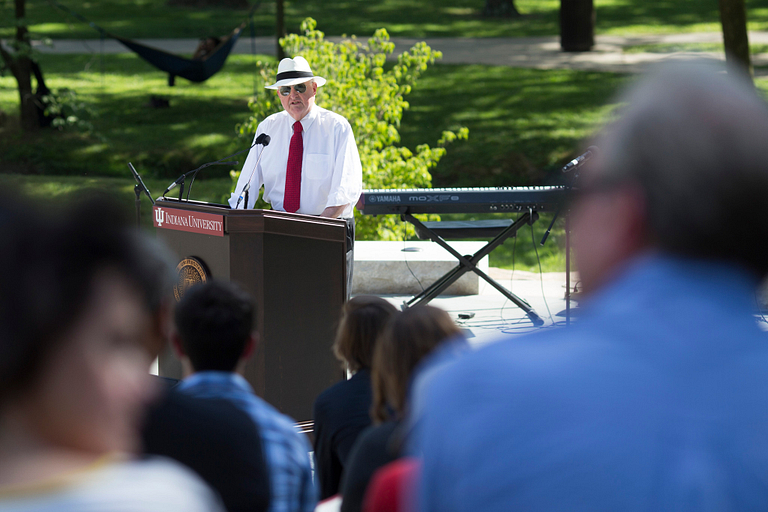 IU President Michael A. McRobbie speaks from the podium on the stage of the Prebys Amphitheater
