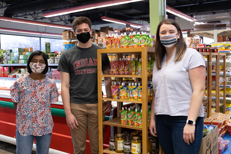 Students standing in a grocery store