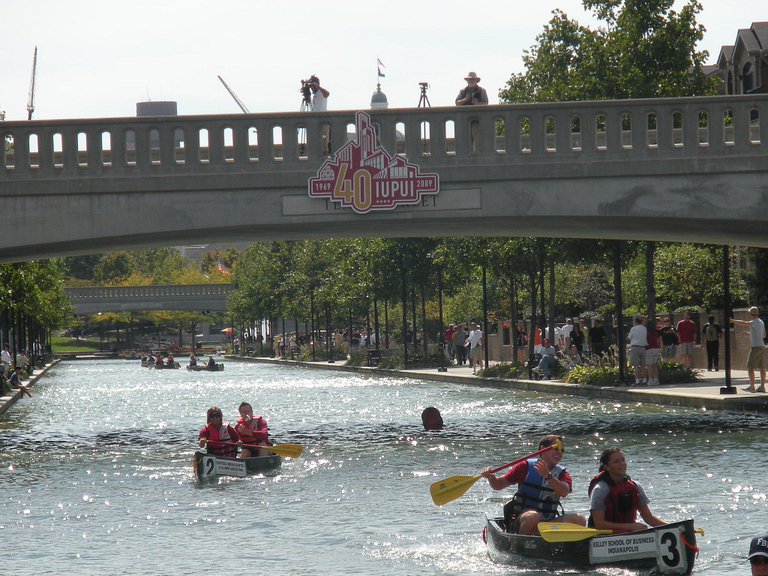 Canoes race in the downtown canal